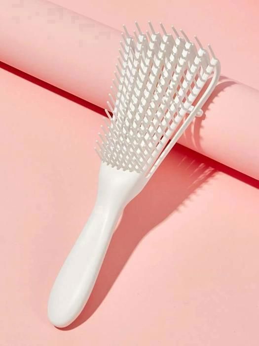 brosse à cheveux rose